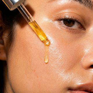 Face Food organic face oil applied with a glass dropper, step two of the Mushroom Envy ritual